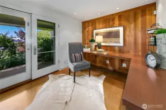 The home office in the lower level with a serene outlook to established greenspace and views to the west.