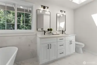 Duel vanities with quartz counters and skylight for natural lighting