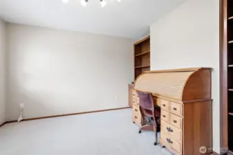 The Office/den is just to the left off of the entryway with double doors and built in cabinet and bookshelves.