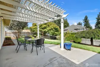The pergola covered patio space - great for grilling, entertaining, gardening, and enjoying this beautiful backyard.
