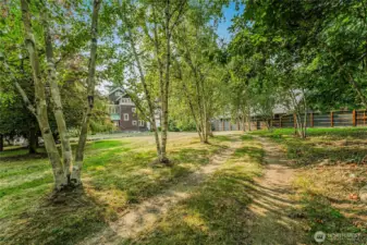 Tucked away beyond the birch tree lined driveway, this 3,477sqft, 4-bedroom, 3.25-bath home is situated on 0.815 of an acre on Camano Island, the no ferry needed island.