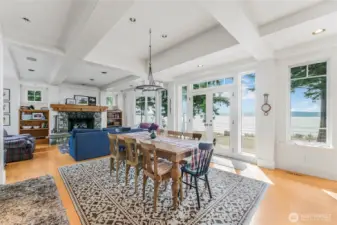 Open concept and coffered ceilings are just some of the architectural features of this incredible home.