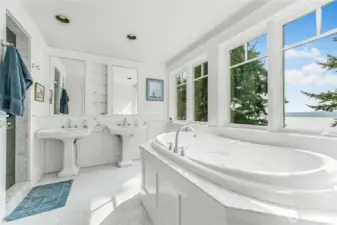 The primary bedroom’s 5-piece ensuite complete with a jetted tub, two sinks and shower.