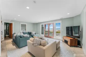 Walk-out to the patio, property and beach access from the ground level living space.