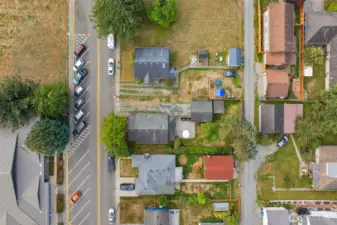 Prime location - across from the library, all new driveway gravel and alley access in back makes this lot turnkey!