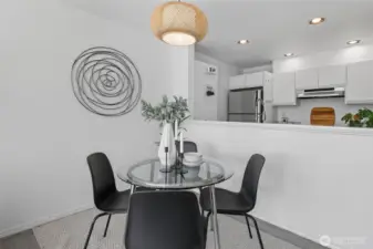 Cute dining area with new lighting.