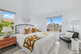 Bright primary bedroom with large closet.