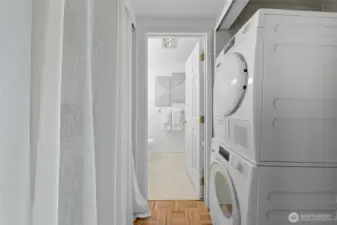 In-unit washer/dryer & behind that curtain can be a large pantry or just extra storage. You decide!