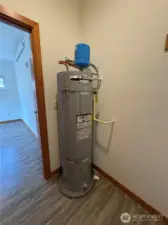 Hot water heater located in closet.