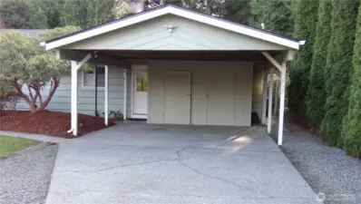 Storage shed in carport