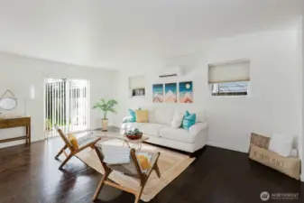 Light and bright open concept living room w/ mini-split for easy climate control.