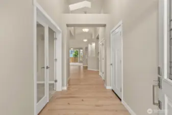 Welcome home! Step into the entry hall with hardwood flooring, contemporary details and white millwork throughout. Clear glass doors leading to den/office or 3rd bedroom.