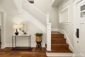 Enter into a gracious entry and classic staircase