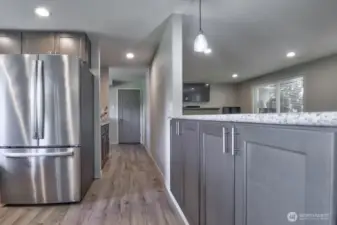 View from the eating area.  Bar area with cabinets on the right