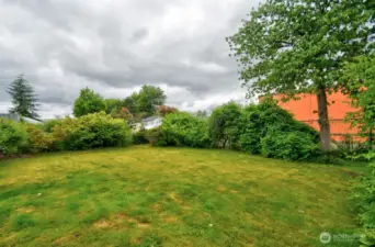 View of the backyard. Shed and shop is on the right side