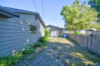 Driveway to the detached garage and space for additional cars or RV