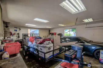 Need a shop for your hobbies - this home has the space! View of the shop with cabinets on the left