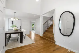 High ceiling entrance, updated staircase and hardwood floors