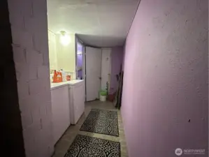 At the end of hall is exterior exit to back yard.  Bathroom to left at end of hall.