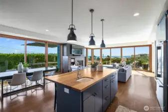 Floor-to-ceiling, south-facing fir windows and  sliding doors