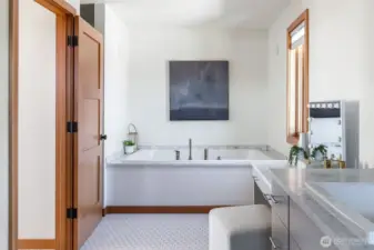 Carrara marble countertops and shower tile