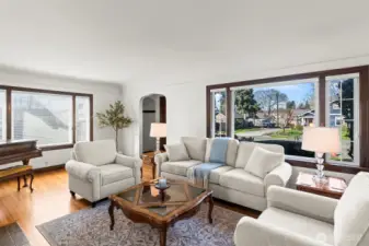 Spacious Living Room: Bathed in natural light from expansive windows, the living room offers a perfect blend of comfort and elegance. The pristine hardwood floors and neutral palette create a versatile space for any decor.