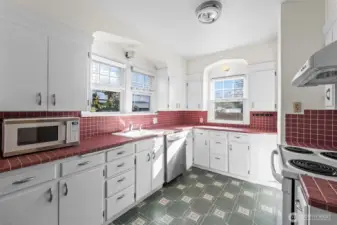 Vintage Kitchen: This bright, spacious kitchen brings a pop of personality with tile countertops and classic white cabinetry. With plenty of prep space and vintage charm, it’s a delightful space for the home chef.