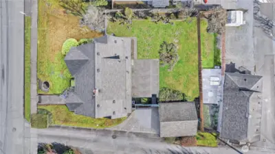 Aerial Overview: From above, you can appreciate the scale of this generous lot. The combination of the spacious backyard, the detached garage, and the prime corner-style positioning makes this 1930s Tudor a rare find.