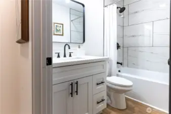 The main bath also has a bathtub.