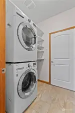 Main level laundry room leading to 2 car garage