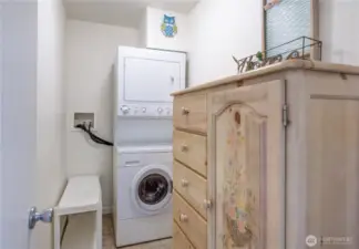 Laundry Room with stackable washer and dryer included.