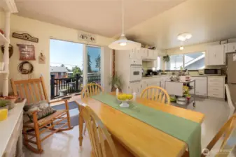 Kitchen with eating area and slider to back deck.