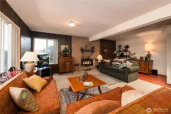 Lower Level Bonus Room with wood burning fireplace.