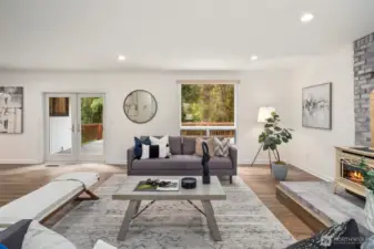 This living area offers effortless flow to the outdoors. The French doors lead directly to the deck, perfect for entertaining or relaxing in a private setting.