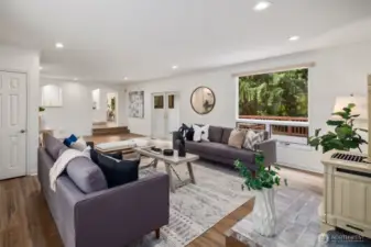 Spacious and thoughtfully designed, warm wood-toned flooring adds to the inviting feel, while subtle architectural details enhance the charm of the space.