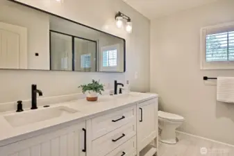 Freshly updated 3/4 bath with ceramic tiled floors & shower.
