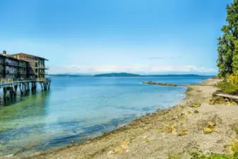Take your cup of coffee across the street to enjoy the beach each morning or set out a blanket in the evenings for picture-perfect sunset picnics on the sound with an Olympic Mountain Range backdrop, and your new home directly across the street.