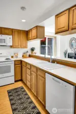 New appliances and fixture updates make this modest, functional kitchen sparkle!