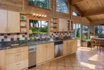 Spacious kitchen with lots of granite counter space and good views from the sink.