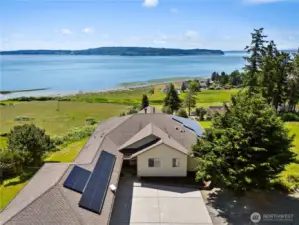 Unobstructed, Sweeping Saltwater Views from every room!  Active Solar Panels, lots of extra parking on over two acres.