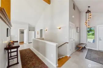 Here is a photo of the entrance and coat closet.  That open door at the very end is the Primary Suite.  The first  open door on the right side is the Guest Bedroom with a full bathroom.  The second door is another Guest bathroom.