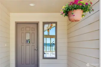 Here is the front door entrance.  If you look, you can see the views through the side glass!  There is a skylight above allowing more natural light.