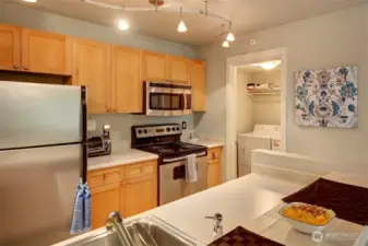 Laundry room off kitchen and storage/pantry space