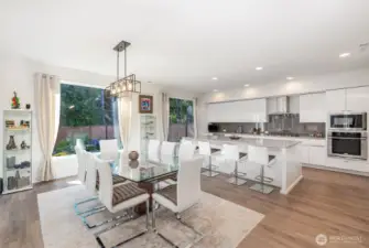 Beautiful dining area flows seamlessly into the kitchen, creating a warm and inviting space perfect for everyday living and entertaining.