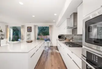 The supersized island provides abundant storage and counter space, along with ample seating—perfect for casual dining and effortless entertaining.