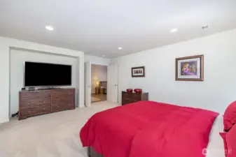 Spacious upstairs primary offers French door entry, recessed lighting, mirroring windows and functional cut outs.