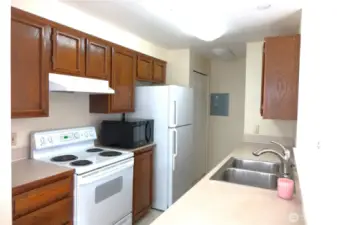 Nice and clean kitchen with plenty of cabinet space.