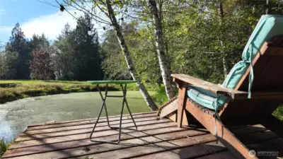 A deck on the island with seating, doesn't it feel tranquil, even through the picture.