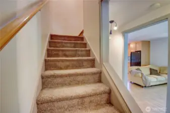 Carpeted stairway leading to the second floor.