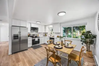 Renovated from top to bottom with beautiful cabinets, quartz countertops, a tile backsplash, and top-tier appliances.
